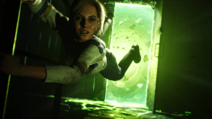 A female character hangs by her fingertips above a glowing green portal.