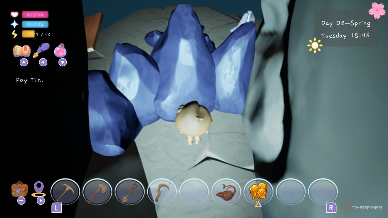 Player standing in front of rocks in the mines entrance in Garden Witch Life.