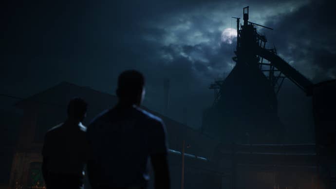 A character approaches the steel mill, on a night so dark that the top of the building is barely illuminated by the moon.